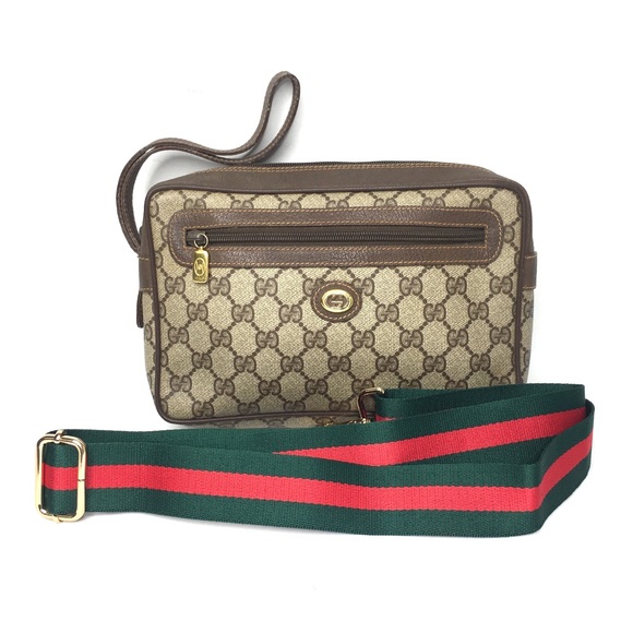 Authentic Gucci brown monogram coated canvas clutch bag